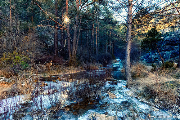 Sunset in a frozen creek